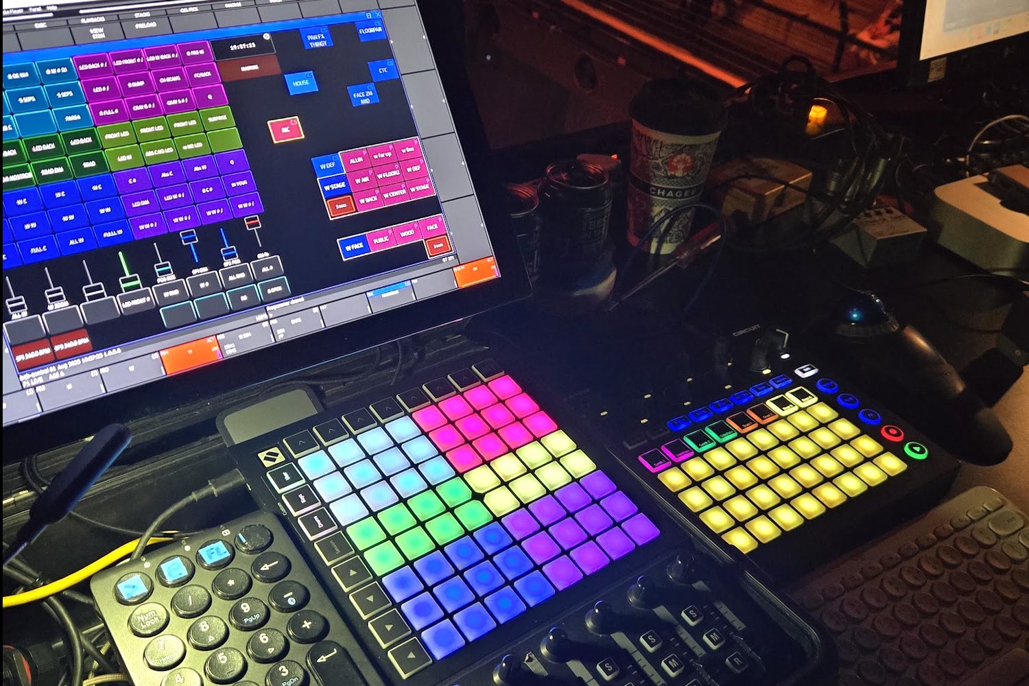 The DIY control desk at front of house: MagicQ execute page, two Launchpads, and the nanoKONTROL2 fader bank